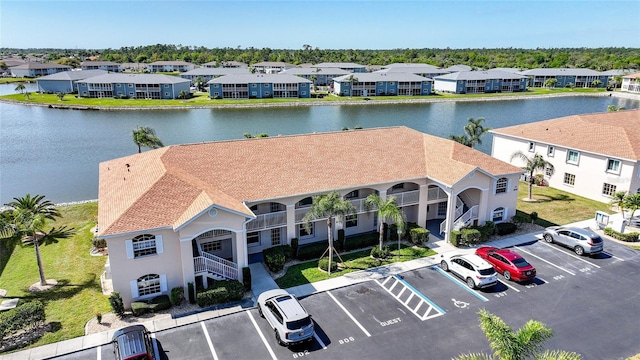 aerial view featuring a water view and a residential view