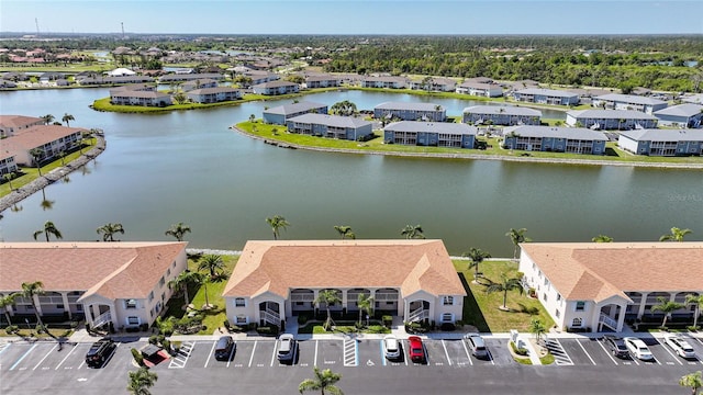 bird's eye view featuring a residential view and a water view