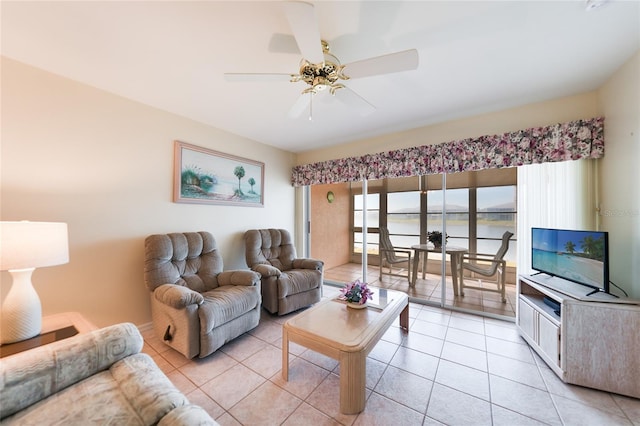 living room featuring light tile patterned floors and ceiling fan