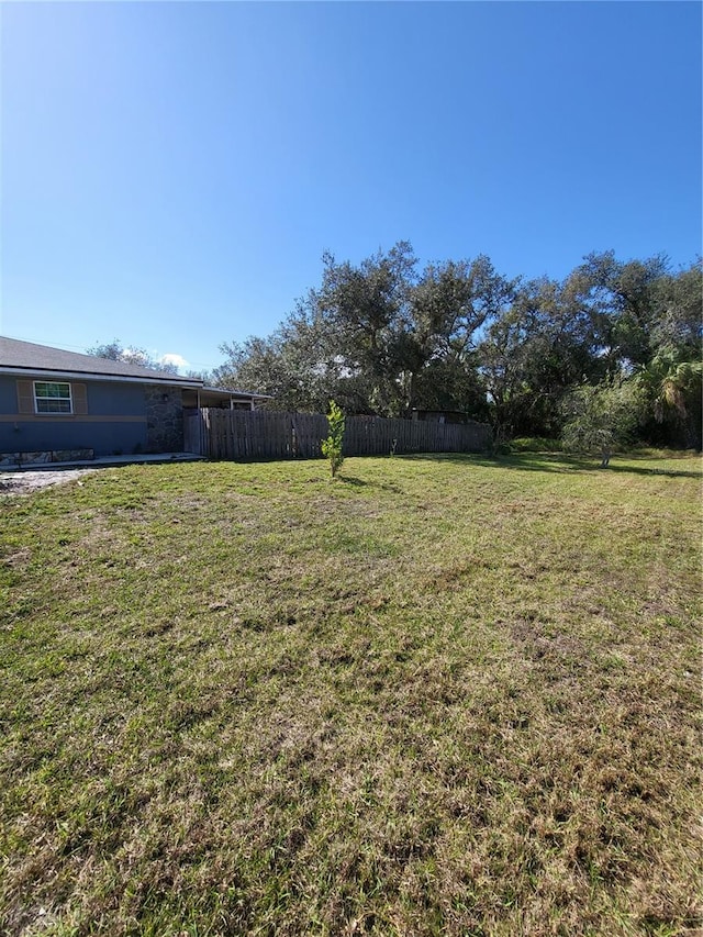 view of yard featuring fence