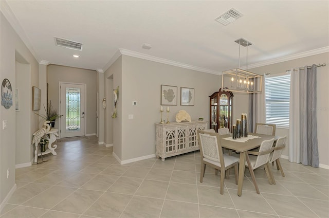 dining area with light tile patterned floors, visible vents, and ornamental molding