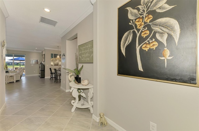 hall with recessed lighting, visible vents, baseboards, tile patterned floors, and crown molding