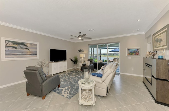 living room with ornamental molding, light tile patterned flooring, visible vents, and baseboards