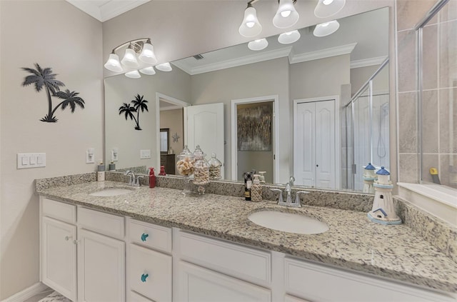 bathroom featuring a shower stall, ornamental molding, and a sink