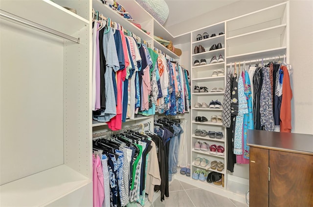 spacious closet featuring tile patterned floors