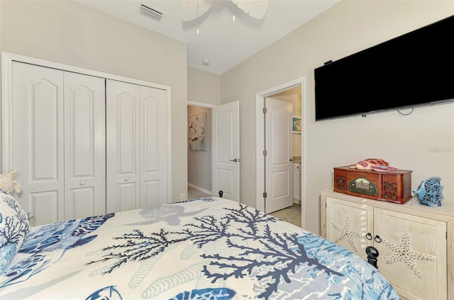 bedroom with ceiling fan, a closet, tile patterned flooring, and visible vents