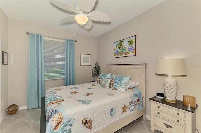 bedroom with a ceiling fan, light tile patterned flooring, and baseboards