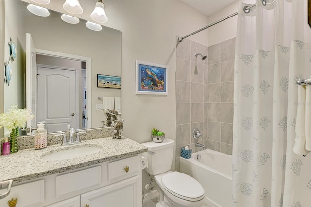 bathroom featuring toilet, shower / bath combo with shower curtain, and vanity