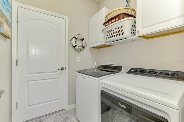 laundry area with washing machine and dryer and cabinet space