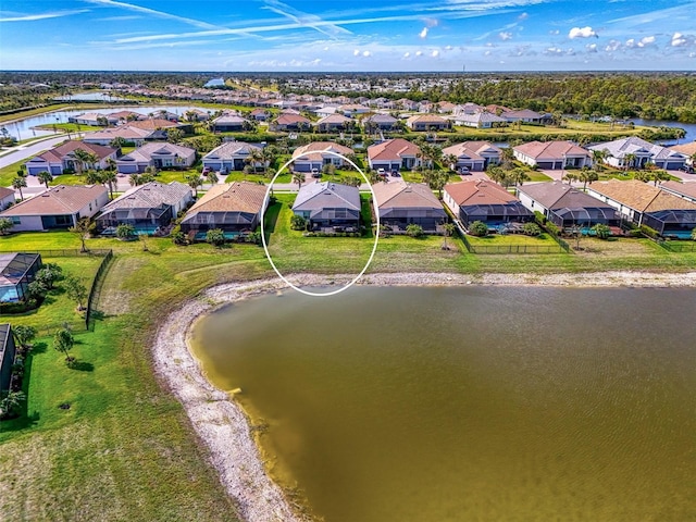 bird's eye view with a water view and a residential view