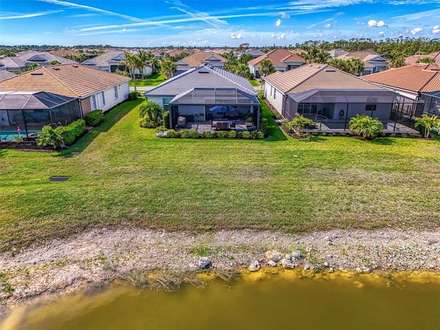 aerial view with a residential view and a water view