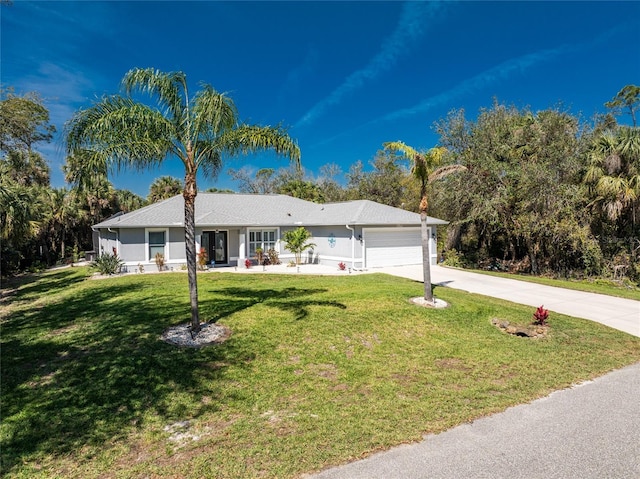 single story home with driveway, a front lawn, and an attached garage