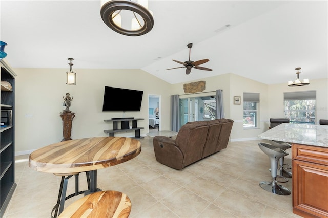 living room with lofted ceiling, light tile patterned floors, a ceiling fan, visible vents, and baseboards