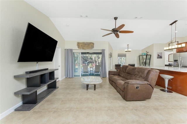 living room featuring light tile patterned floors, visible vents, a ceiling fan, vaulted ceiling, and baseboards