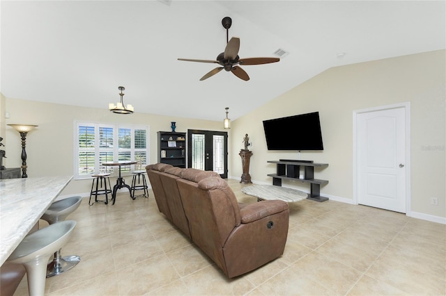 living area with baseboards, visible vents, a ceiling fan, lofted ceiling, and light tile patterned flooring