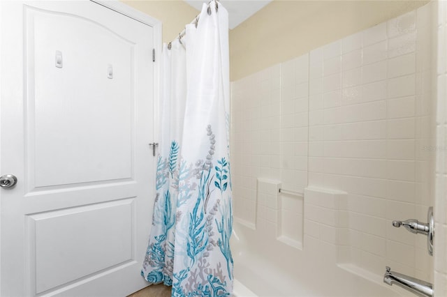 bathroom featuring shower / tub combo with curtain