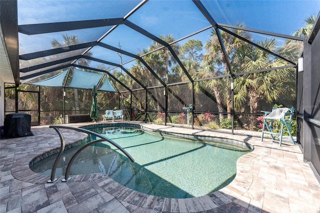 outdoor pool featuring a lanai and a patio area