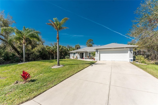 single story home featuring driveway, stucco siding, an attached garage, and a front yard