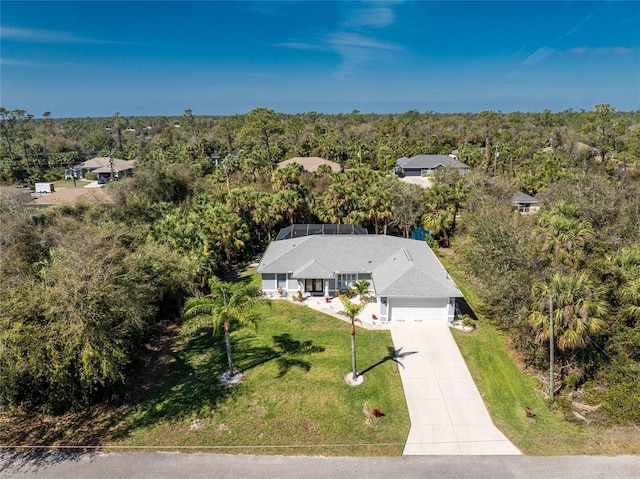 aerial view featuring a view of trees