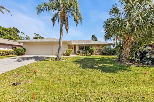 single story home featuring a garage, driveway, and a front lawn