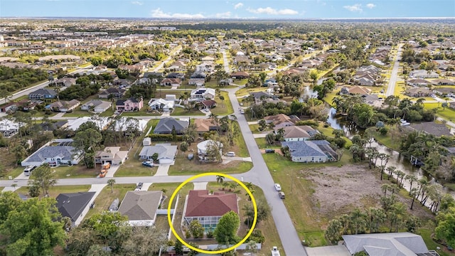 birds eye view of property with a residential view