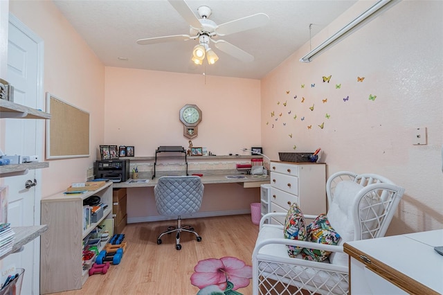 home office featuring ceiling fan and light wood finished floors