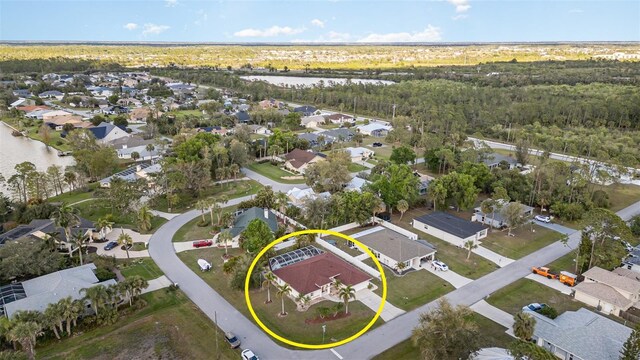 bird's eye view featuring a residential view and a water view