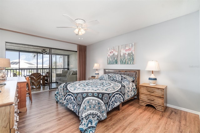 bedroom featuring access to outside, ceiling fan, baseboards, and wood finished floors