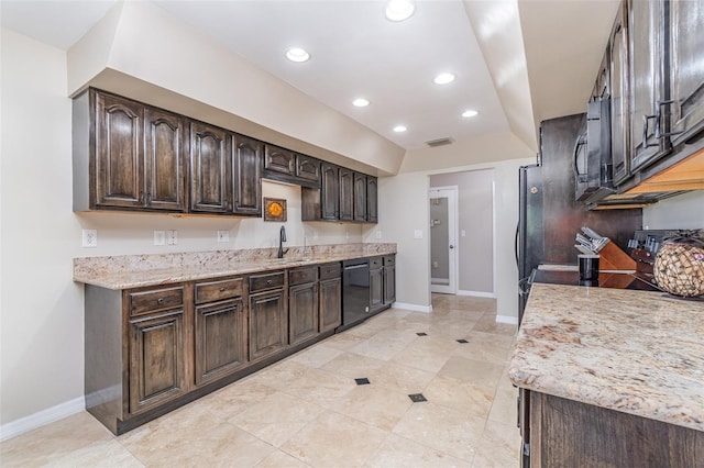 kitchen with recessed lighting, a sink, visible vents, dark brown cabinets, and black appliances