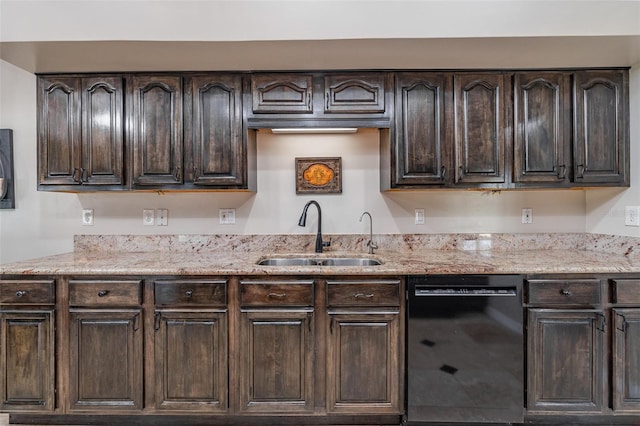 kitchen with light stone countertops, black dishwasher, dark brown cabinets, and a sink