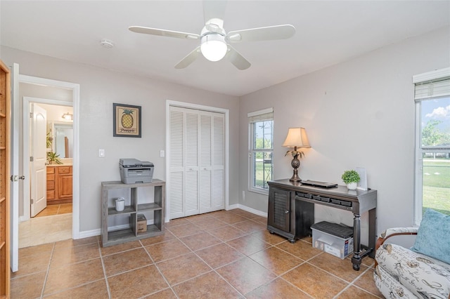 entrance foyer with a healthy amount of sunlight, baseboards, and tile patterned floors