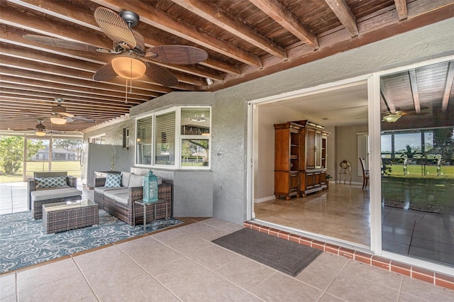 view of patio / terrace featuring ceiling fan and an outdoor living space