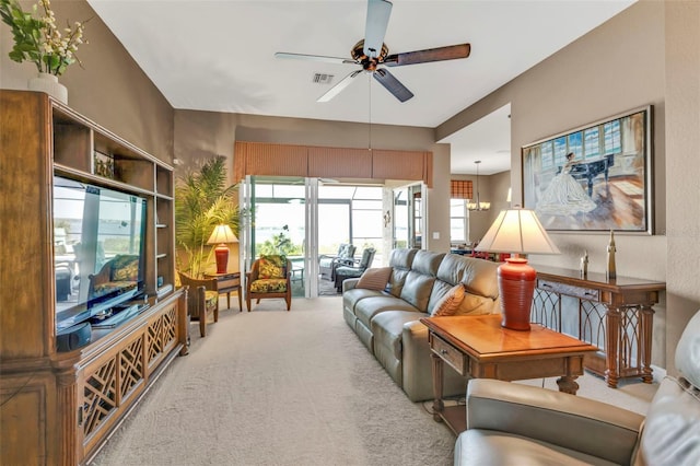 living area featuring a ceiling fan, carpet flooring, and visible vents