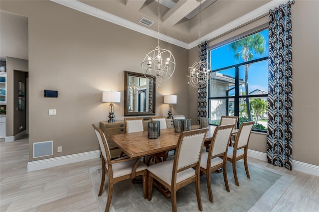 dining area featuring baseboards, visible vents, crown molding, light wood-type flooring, and a notable chandelier