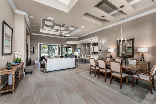 dining room with ceiling fan with notable chandelier, a high ceiling, coffered ceiling, visible vents, and ornamental molding