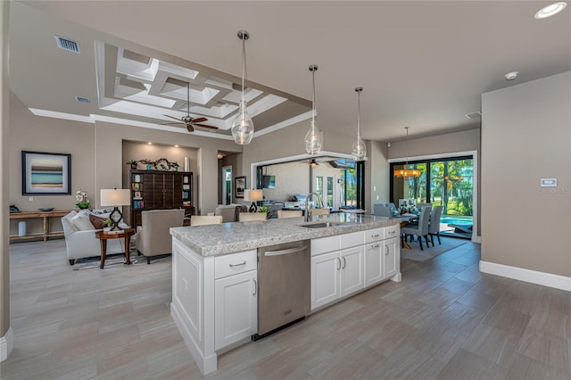 kitchen with visible vents, stainless steel dishwasher, open floor plan, a sink, and ceiling fan