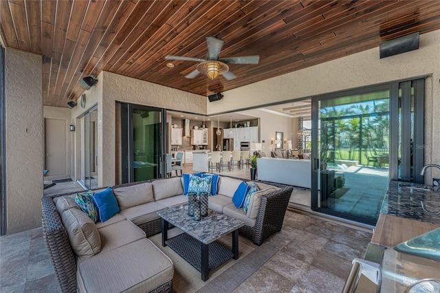 view of patio featuring an outdoor hangout area and a sink