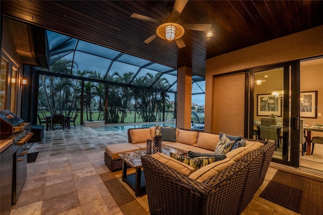 view of patio / terrace with an outdoor pool, ceiling fan, a lanai, and outdoor lounge area