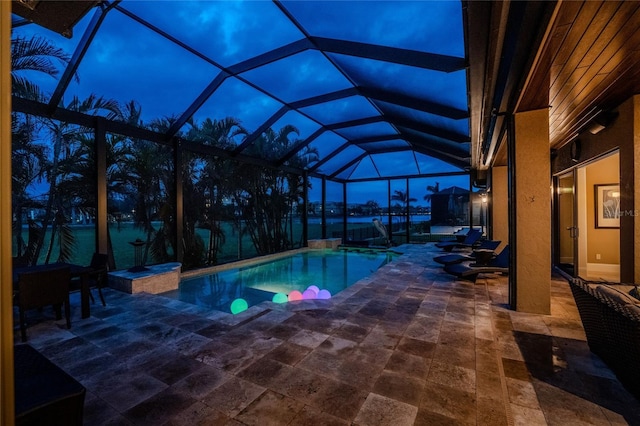 outdoor pool featuring a lanai and a patio