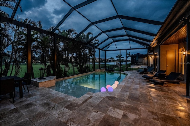 pool with a lanai and a patio