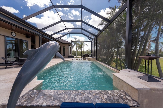 outdoor pool with a patio area and a lanai