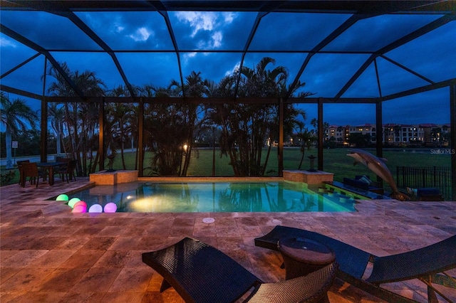 outdoor pool featuring a lanai, a patio, and a lawn