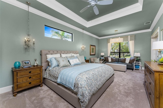 carpeted bedroom with baseboards, visible vents, a raised ceiling, ceiling fan, and crown molding