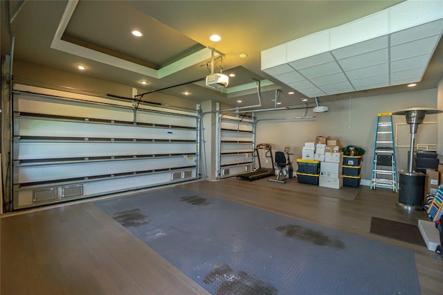 garage featuring a garage door opener and recessed lighting