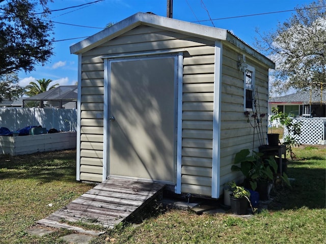 view of shed with fence