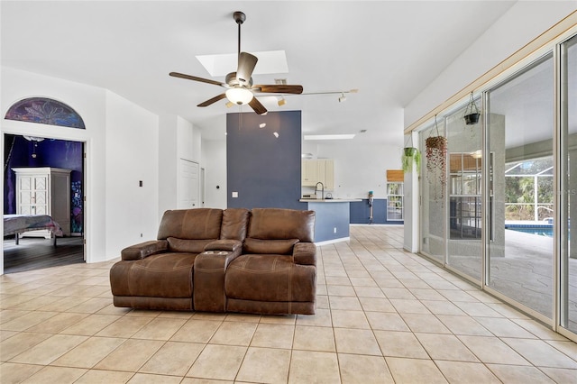 living room with light tile patterned floors and ceiling fan