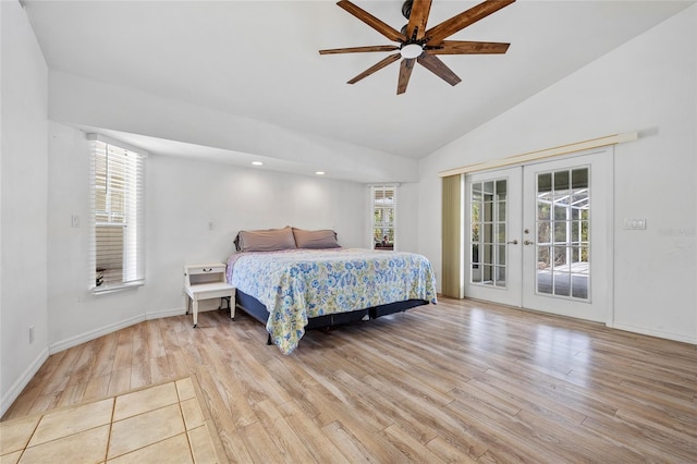 bedroom featuring wood finished floors, baseboards, vaulted ceiling, french doors, and access to outside