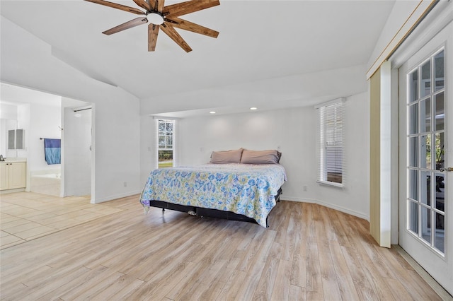 bedroom with ceiling fan, baseboards, vaulted ceiling, light wood-style floors, and ensuite bath