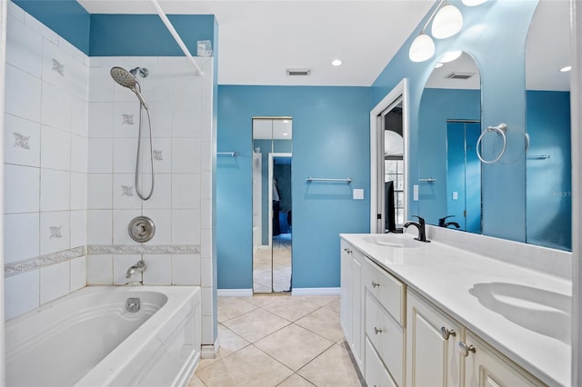 full bathroom with visible vents, double vanity, a sink, shower / tub combination, and tile patterned floors