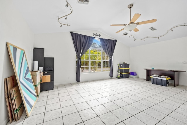 interior space featuring visible vents, a ceiling fan, and vaulted ceiling